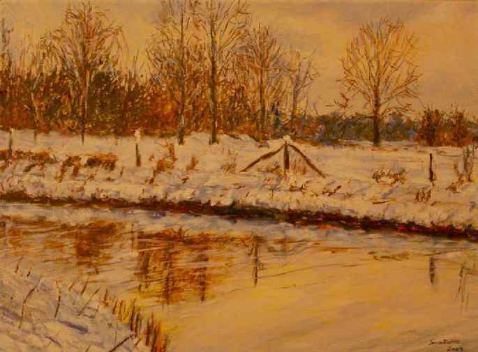 Snow covered field at sunrise